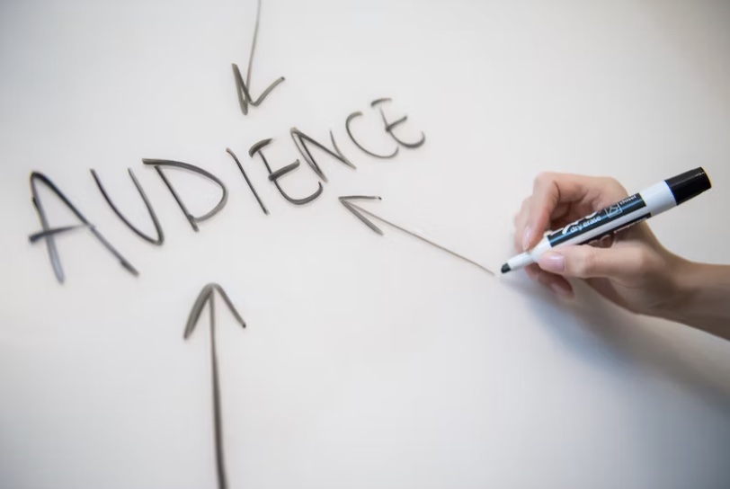 the word audience written on a white board